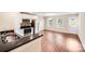 Modern kitchen featuring stainless steel appliances, white cabinetry, black countertops and views to dining area at 115 Dove Sw Ave, Concord, NC 28025