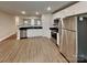 Modern kitchen featuring stainless steel appliances and white cabinets at 115 Dove Sw Ave, Concord, NC 28025