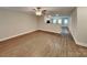 Spacious living room open to kitchen, with modern wood flooring at 115 Dove Sw Ave, Concord, NC 28025