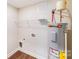 Clean utility room features water heater, shelving, washer and dryer hookups at 115 Dove Sw Ave, Concord, NC 28025
