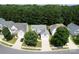 Aerial view of a well-maintained neighborhood with lush landscaping at 12341 Mcallister Park Dr, Charlotte, NC 28277