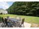 Lush backyard with patio dining set, perfect for outdoor gatherings at 12341 Mcallister Park Dr, Charlotte, NC 28277