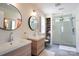 Modern bathroom with double vanity sinks, a spacious glass-enclosed shower, and bright lighting at 12341 Mcallister Park Dr, Charlotte, NC 28277