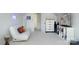 Cozy bonus room with a white futon, entertainment center, and a modern touch at 12341 Mcallister Park Dr, Charlotte, NC 28277