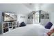 Expansive bonus room with vaulted ceiling, built-in shelving, and plush seating at 12341 Mcallister Park Dr, Charlotte, NC 28277