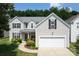 Charming two-story home with a well-manicured front yard and a two-car garage offers great curb appeal at 12341 Mcallister Park Dr, Charlotte, NC 28277