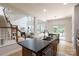 Open-concept kitchen and living area with island seating, flowing layout, and lots of natural light at 12341 Mcallister Park Dr, Charlotte, NC 28277