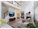 Bright living room with high ceilings, fireplace, and modern decor showcasing an open floor plan at 12341 Mcallister Park Dr, Charlotte, NC 28277