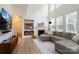 Bright living room with fireplace and large windows, offering abundant natural light at 12341 Mcallister Park Dr, Charlotte, NC 28277