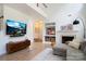 Comfortable living room with a gray sectional sofa, a fireplace, and built-in shelving at 12341 Mcallister Park Dr, Charlotte, NC 28277