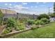 A luscious backyard featuring a large garden on a sunny day at 1300 Reece Rd # 305, Charlotte, NC 28209