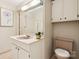 Bathroom features a vanity with a brown sink and toilet at 1300 Reece Rd # 305, Charlotte, NC 28209