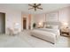 Comfortable bedroom featuring a ceiling fan, a walk-in closet, and soothing colors at 1300 Reece Rd # 305, Charlotte, NC 28209