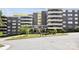 Exterior of a condo building with balconies and an American flag at 1300 Reece Rd # 305, Charlotte, NC 28209