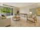 Bright living room features a sliding glass door and modern decor at 1300 Reece Rd # 305, Charlotte, NC 28209