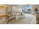 Bright living room features a sliding glass door, modern decor, and lots of natural light at 1300 Reece Rd # 305, Charlotte, NC 28209