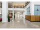 Well-lit lobby with terrazzo floors, modern decor, and a view of the second floor at 1300 Reece Rd # 305, Charlotte, NC 28209