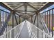 View of a metal pedestrian bridge with sky and building views at 1300 Reece Rd # 305, Charlotte, NC 28209