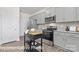 Bright kitchen showcasing stainless appliances, granite counters, gray cabinetry, and functional island at 1339 37Th Avenue Ne Ln, Hickory, NC 28601