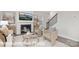 Cozy living room featuring a fireplace, stylish decor, comfortable seating, and a staircase at 1339 37Th Avenue Ne Ln, Hickory, NC 28601