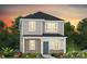 Charming two-story home featuring a gray color palette, covered entry, and manicured landscaping at 14024 Penbury Ln # 330, Charlotte, NC 28278