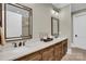 Bathroom featuring double vanity with stone countertop and modern fixtures at 1430 Rosehill Dr, Waxhaw, NC 28173