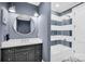 Chic bathroom featuring modern fixtures, stylish vanity, and a shower-tub combo at 1430 Rosehill Dr, Waxhaw, NC 28173