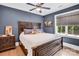 Comfortable bedroom with blue walls, neutral bedding, and plenty of natural light at 1430 Rosehill Dr, Waxhaw, NC 28173