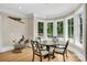 Bright breakfast nook boasts large windows with backyard views and a pool at 1430 Rosehill Dr, Waxhaw, NC 28173