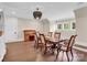 Elegant dining room with hardwood floors, decorative light fixture, and classic furniture at 1430 Rosehill Dr, Waxhaw, NC 28173
