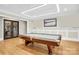 Spacious game room includes a billiard table, iron door, and modern lighting at 1430 Rosehill Dr, Waxhaw, NC 28173