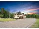 Stunning home with a spacious driveway leading to a three-car garage and lush green lawn at 1430 Rosehill Dr, Waxhaw, NC 28173