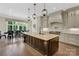 Spacious kitchen with a large island, stainless steel appliances, and hardwood floors at 1430 Rosehill Dr, Waxhaw, NC 28173