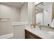 Stylish powder room with a decorative mirror, granite countertop, elegant sink, and refined finishes at 1430 Rosehill Dr, Waxhaw, NC 28173