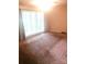 Bright and airy bedroom featuring neutral carpet and large window with vertical blinds at 1628 Cecelia Dr, Gastonia, NC 28054