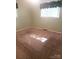 A neutral bedroom with green walls, tan carpet, and a window at 1628 Cecelia Dr, Gastonia, NC 28054