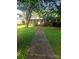 Charming brick home featuring a covered entrance and a walkway leading to the front door at 1628 Cecelia Dr, Gastonia, NC 28054