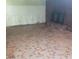 Room with fireplace, paneled walls, baseboard damage, and unique patterned tile floor at 1628 Cecelia Dr, Gastonia, NC 28054