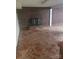 Large living room with brick fireplace and hearth, and a unique patterned tile floor at 1628 Cecelia Dr, Gastonia, NC 28054