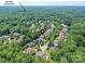 Aerial view of a residential neighborhood nestled among lush greenery, showcasing community and serene surroundings at 18618 Rollingdale Ln, Davidson, NC 28036