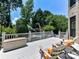 Spacious back deck with outdoor seating, overlooking the backyard and swimming pool for relaxing and entertaining at 18618 Rollingdale Ln, Davidson, NC 28036