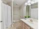 Well-lit bathroom featuring a shower-tub combo and a single sink vanity with ample storage at 18618 Rollingdale Ln, Davidson, NC 28036