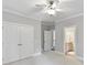 Spacious bedroom offers a ceiling fan, plush carpeting and closet and bathroom access at 18618 Rollingdale Ln, Davidson, NC 28036