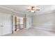 Large bonus room with carpet, ceiling fan, natural lighting and trim work throughout at 18618 Rollingdale Ln, Davidson, NC 28036