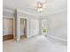 Spacious bedroom with carpet, white trim, a window, and an ensuite bath at 18618 Rollingdale Ln, Davidson, NC 28036