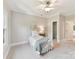 Neutral bedroom with a single bed, ceiling fan, and closet, bathed in natural light at 18618 Rollingdale Ln, Davidson, NC 28036