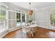 Breakfast nook with a view of the swimming pool through shuttered windows at 18618 Rollingdale Ln, Davidson, NC 28036