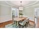 Inviting dining area boasting natural light and minimalist decor at 18618 Rollingdale Ln, Davidson, NC 28036
