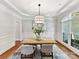 Formal dining room features tray ceiling, large window and neutral color palette at 18618 Rollingdale Ln, Davidson, NC 28036