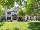 Stunning brick home boasts lush landscaping and a welcoming front yard at 18618 Rollingdale Ln, Davidson, NC 28036